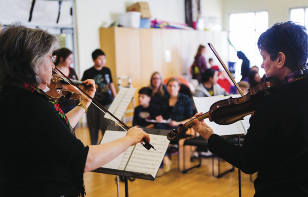 New Jersey Symphony musicians Susan Gellert (L) and Ann Kossakowski (R) perform at Eden Autism Services in Princeton, NJ