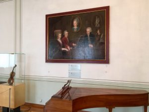 A family portrait hangs above Mozart's old harpsichord in the Mozart Residence