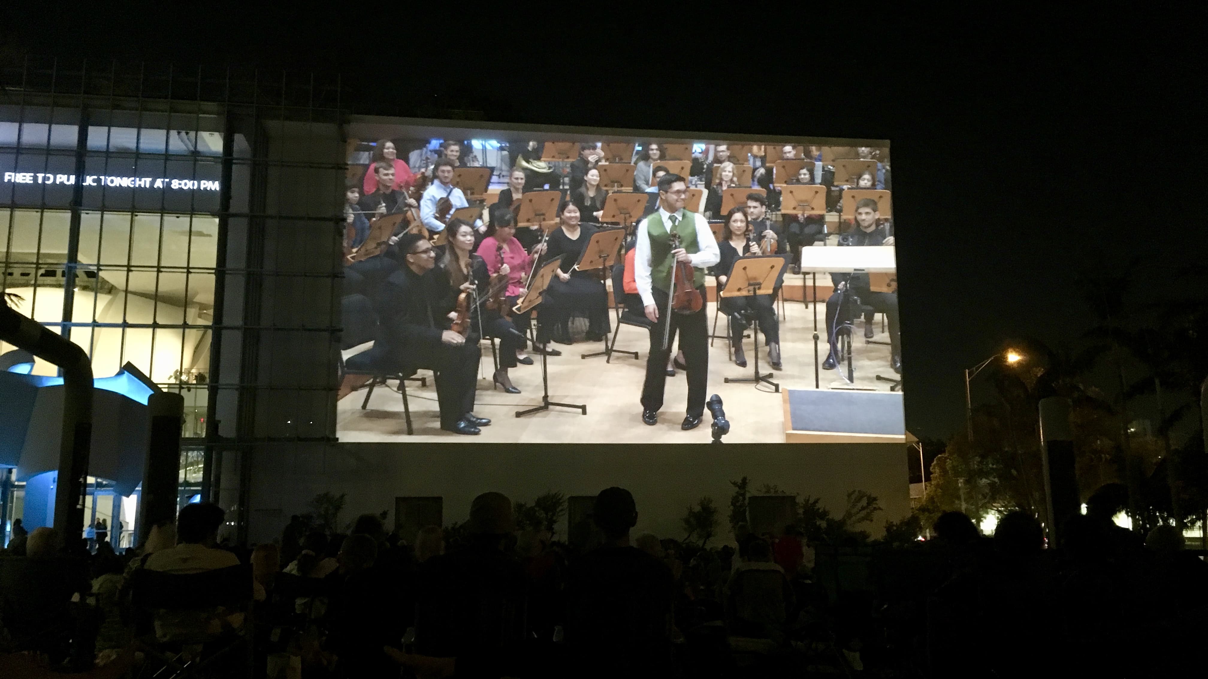 Violinist Matthew Hakkarainen performs with the New World Symphony, as seen on the outdoor Wallcast.